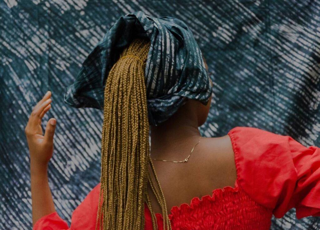 woman in red dress with blue and yellow scarf