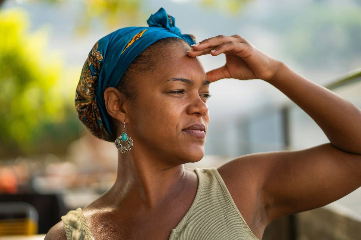 Woman shielding her eyes from the sun