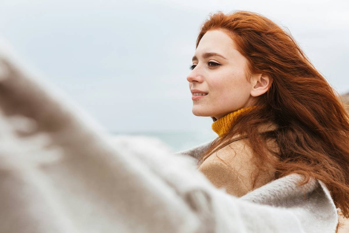 a close up of a woman with red hair
