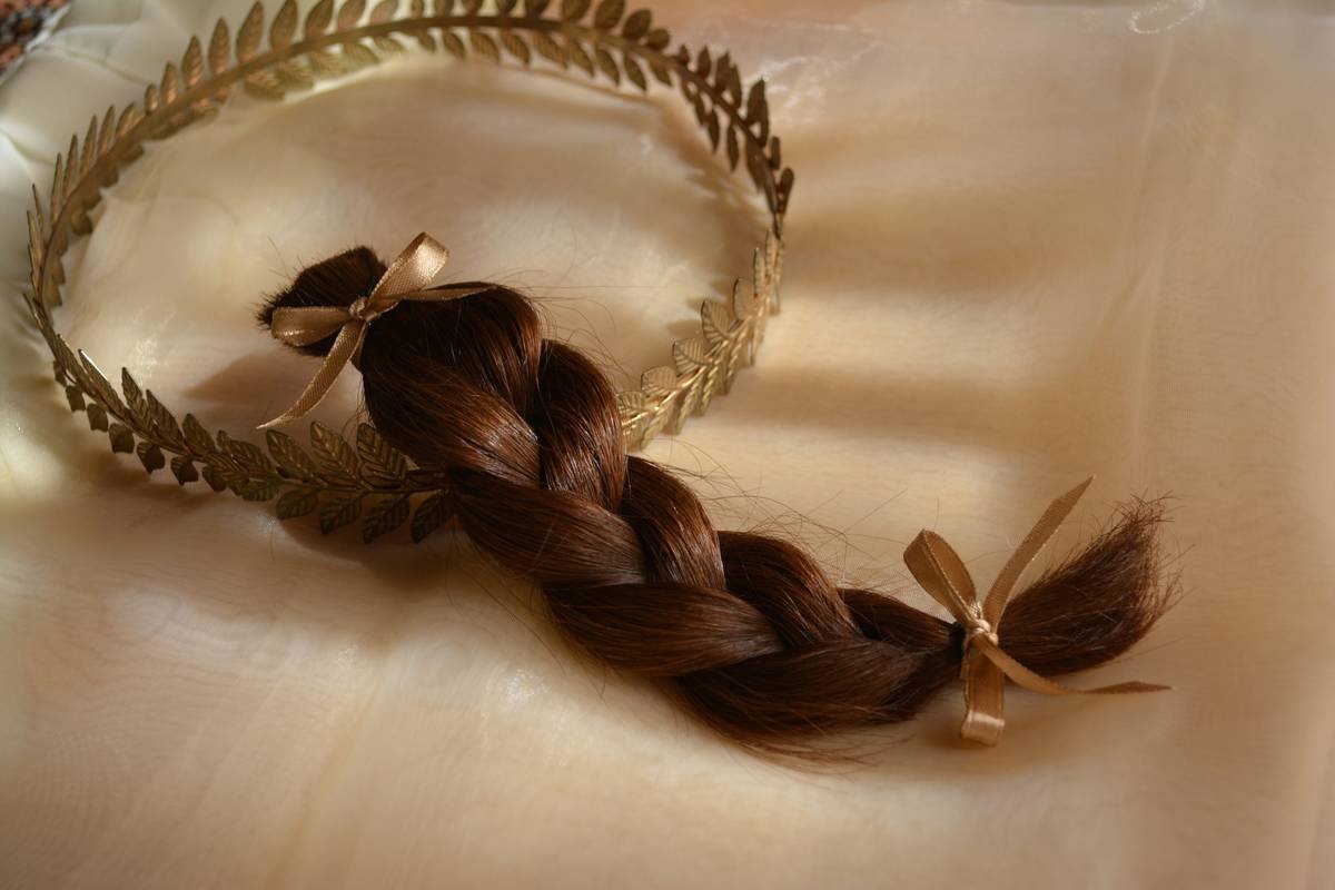 Side-by-side comparison of cotton vs. satin hair turbans showing reduced friction on textured hair strands under magnification